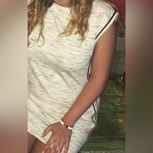 Classy and comfortable dress with full length zippers on both sides.